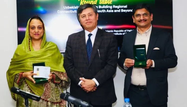 (Middle) The Ambassador of Uzbekistan to Pakistan presenting award to Farhat Asif, the founder and president of the Institute of Peace and Diplomatic Studies (L), and Muhammad Asif Noor, Editor in Chief of The Diplomatic Insight and Global News Pakistan (R).