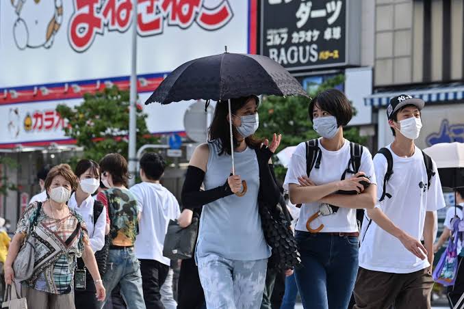 People in Japan wearing masks due to COVID-19 breakout.