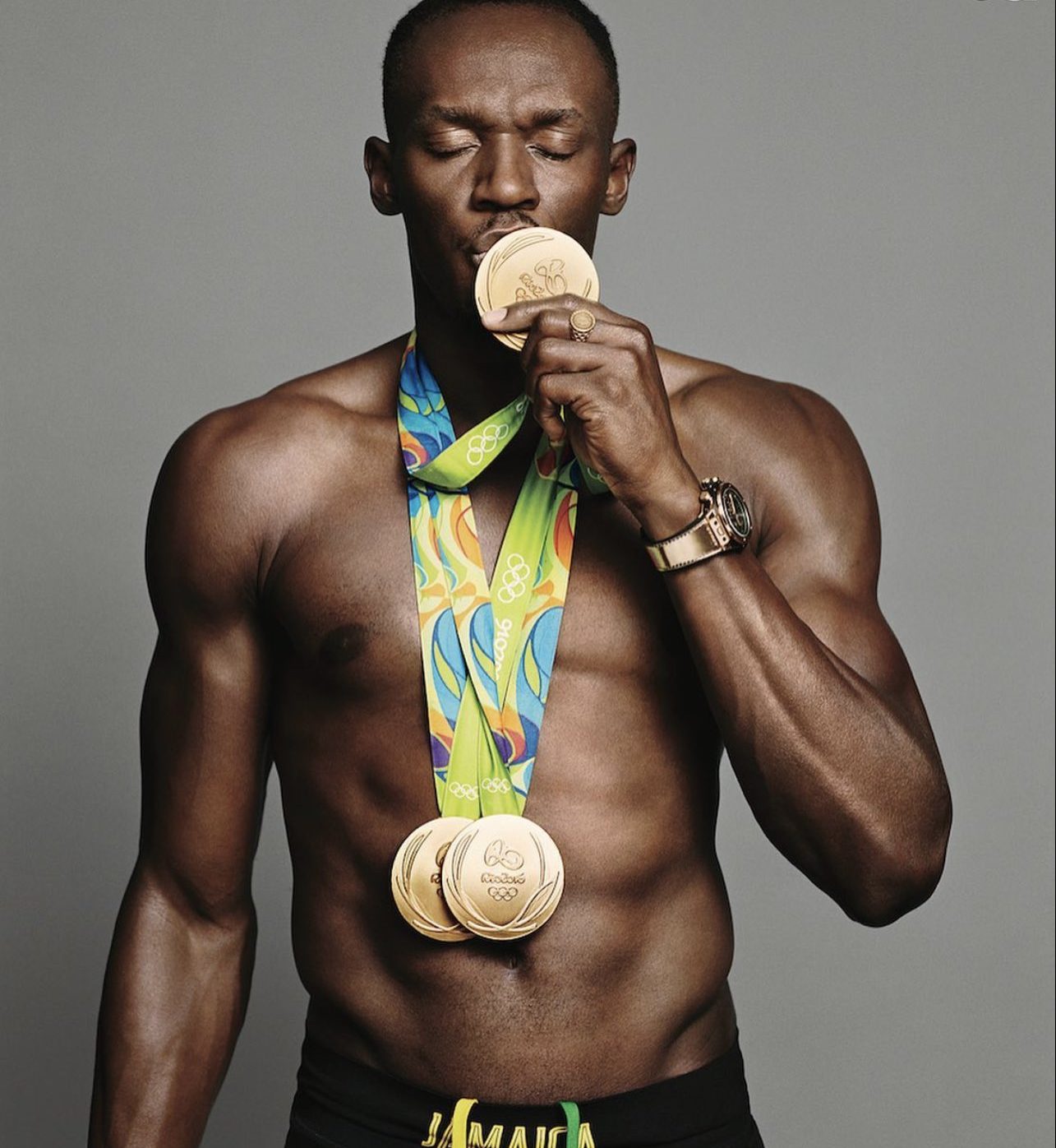 Usain Bolt with Olympics medals.
