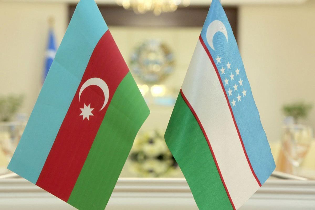 Flags of Azerbaijan (L) and Uzbekistan (R).
