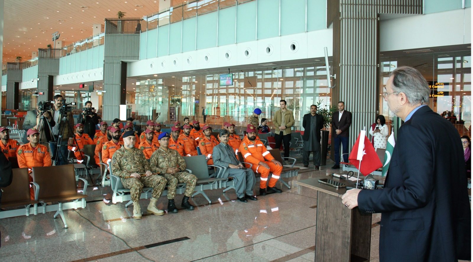 Mehmet pacaci, Turkish ambassador in Pakistan, spoke to Turkiye-return Pakistan army USAR team at Islamabad International Airport.