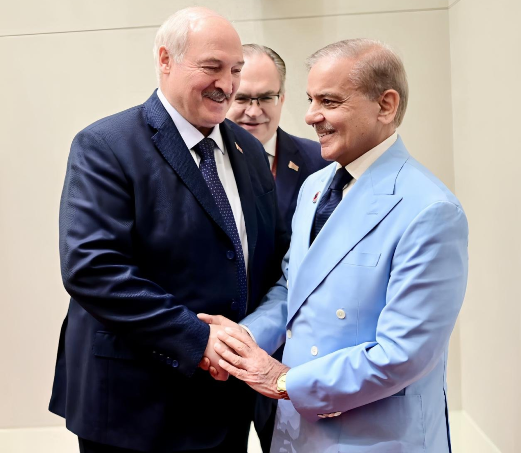 Belarusian President Aleksandr Lukashenko shakes hands with Pakistani Prime Minister Shehbaz Sharif