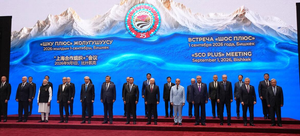 World leaders standing together on stage for a group photo at the SCO Plus meeting in Bishkek